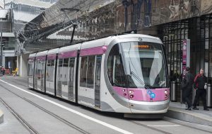 The first Midland Metro tram, number 37, named after Birmingham's most famous son Ozzy Osbourne, leaves New Street Station for the launch of the extended line.