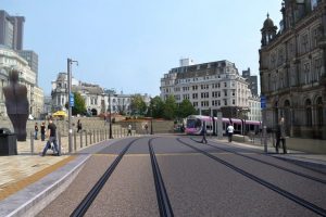 Tram arriving at Victoria Square in front of the Town Hall